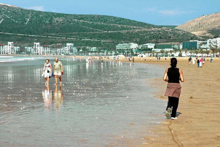 People enjoying a sunny day at Agadir beach in Morocco