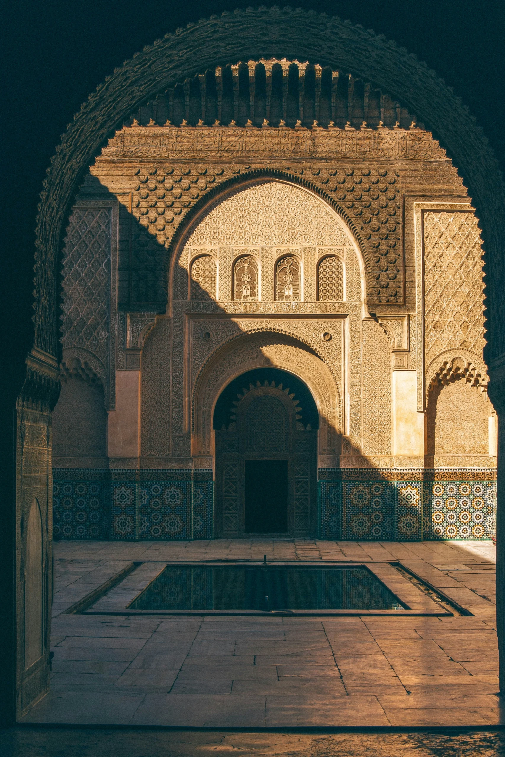Historic Marrakech medina building facade in warm earthy tones during the day