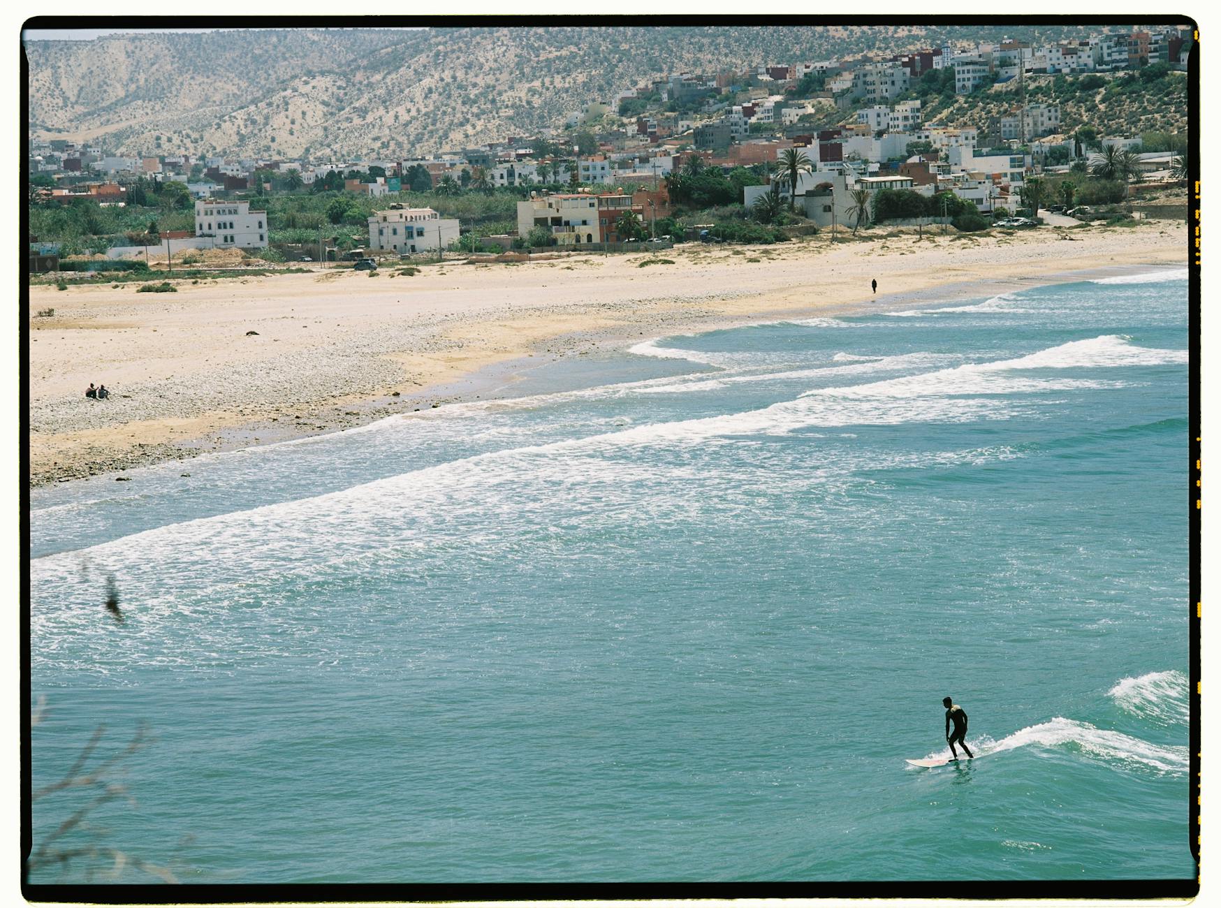 Surfer on the coast near Taghazout in Morocco