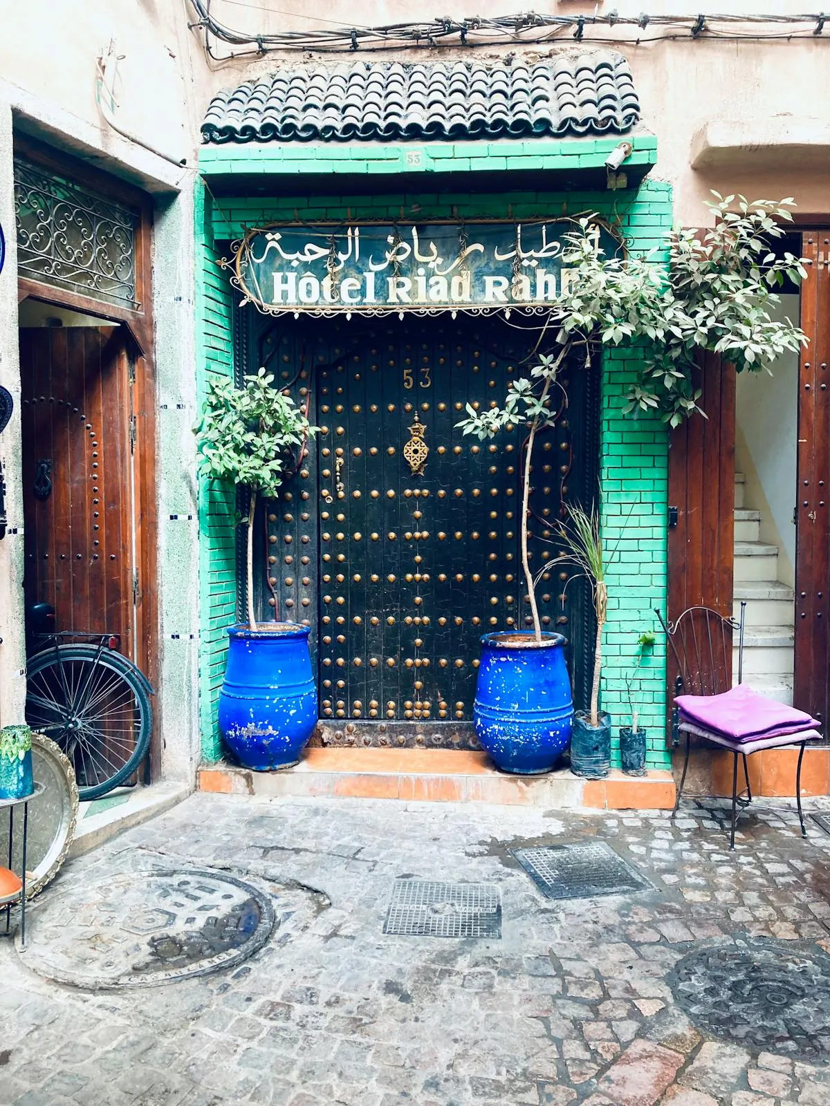 Charming entrance of a small riad in a Moroccan medina