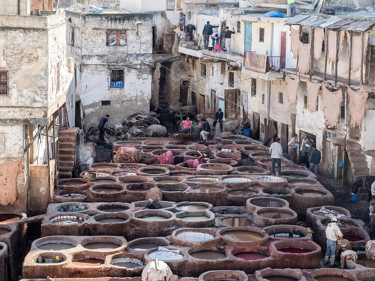 Fes Travel Guide: The Imperial City Handbook (2026) 2 Chouara Tannery in Fes Morocco with circular stone vats filled with coloured dye