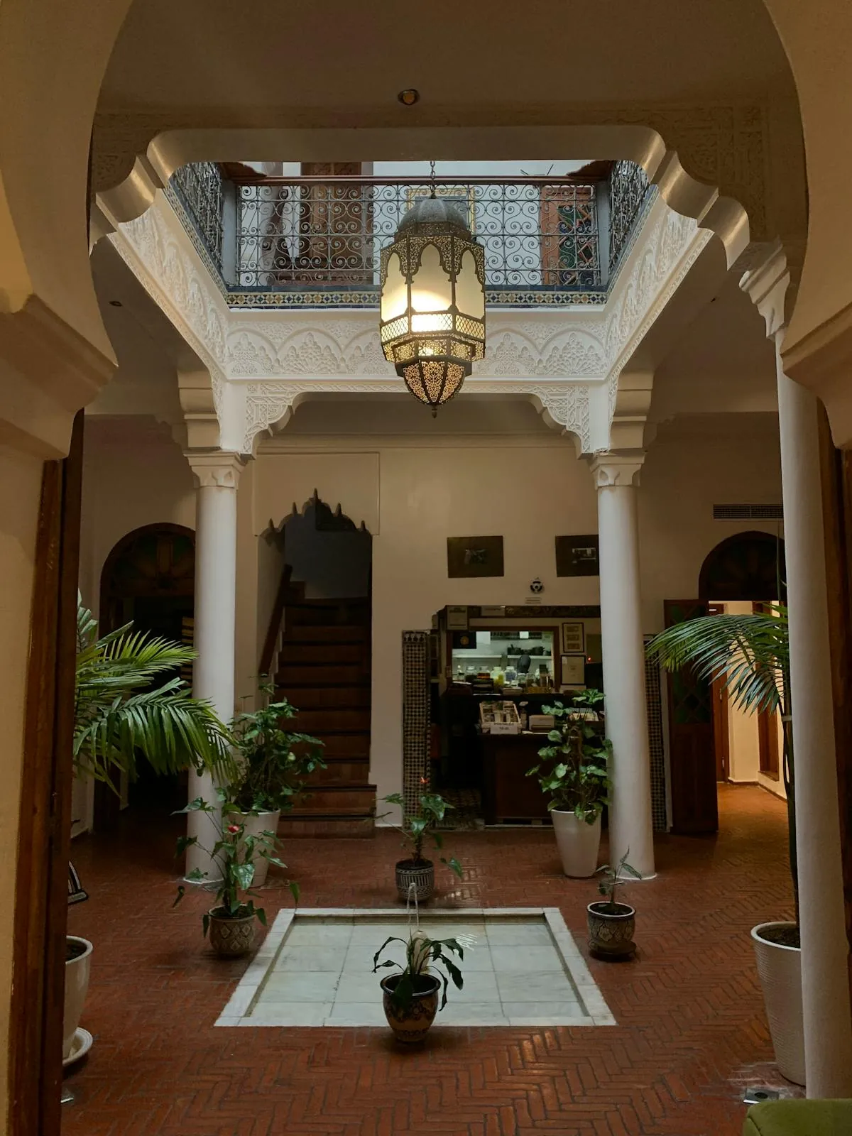 Traditional Moroccan riad architecture with arches and tilework