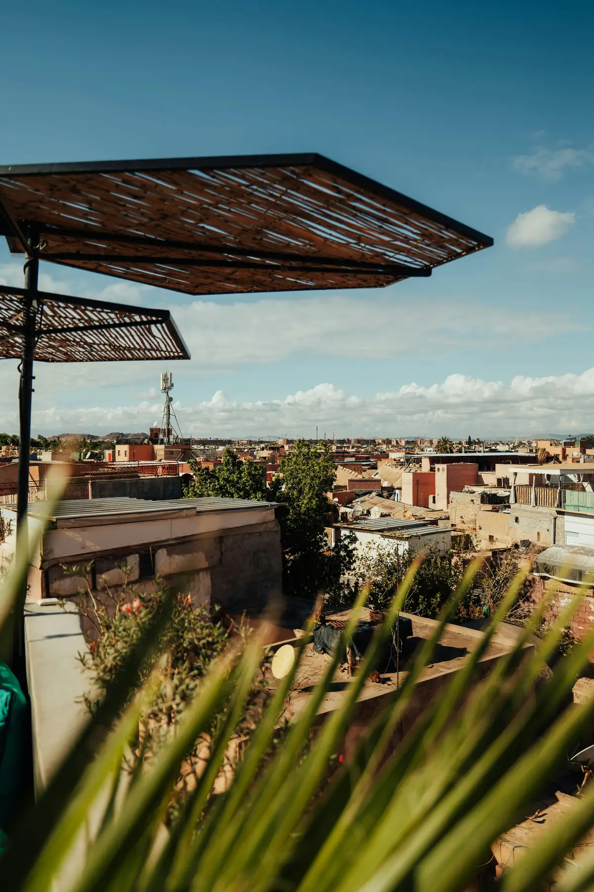 Riad rooftop terrace in Marrakech under May sunshine