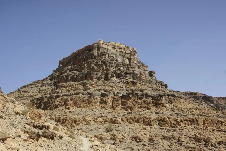 Agadir Id Aissa granary on cliff above oasis