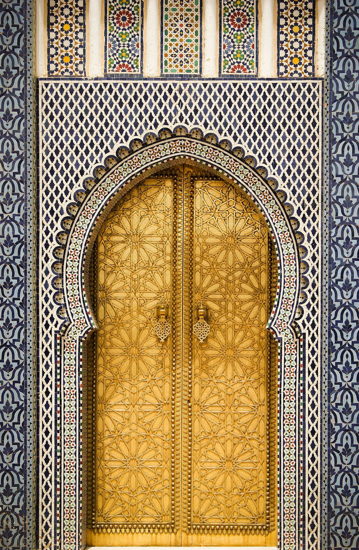 Ornate golden doors of the Royal Palace gate in Fes el-Jdid