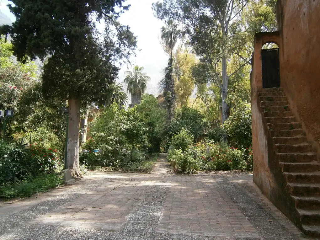 Ochre kasbah walls and stone stairs above the Andalusian garden in Chefchaouen